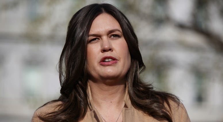 In this April 4, 2019, file photo, White House press secretary Sarah Sanders talks with reporters outside the White House in Washington. In this April 4, 2019, file photo, White House press secretary Sarah Sanders talks with reporters outside the White House in Washington.