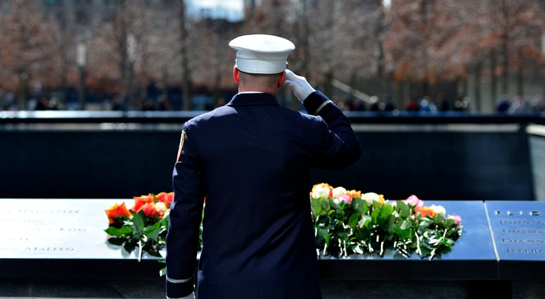 A member of FDNY salutes after placing a flower at the 9/11 Memorial during a ceremony commemorating the 23rd anniversary of the 1993 World Trade Center bombing, in New York, the United States, Feb. 26, 2016. A member of FDNY salutes after placing a flower at the 9/11 Memorial during a ceremony commemorating the 23rd anniversary of the 1993 World Trade Center bombing, in New York, the United States, Feb. 26, 2016.