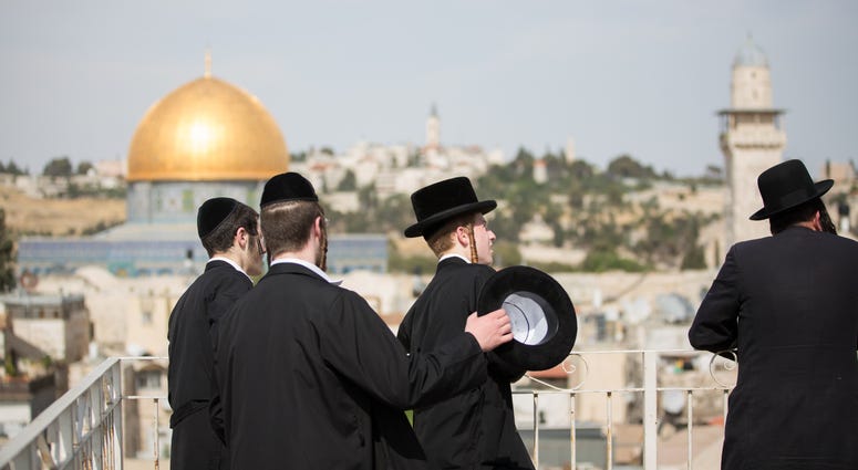 Ultra-Orthodox Jews look towards the direction of the Western Wall during U.S. President Donald Trump's visit to the Western Wall in Jerusalem. Ultra-Orthodox Jews look towards the direction of the Western Wall during U.S. President Donald Trump's visit to the Western Wall in Jerusalem.
