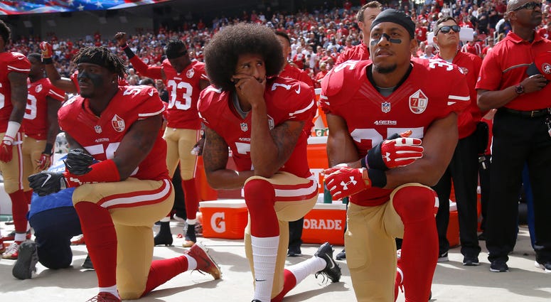 From left: The San Francisco 49ers' Eli Harold (58), Colin Kaepernick (7) and Eric Reid (35) kneel during the national anthem before their a game against the Dallas Cowboys on Oct. 2, 2016. From left: The San Francisco 49ers' Eli Harold (58), Colin Kaepernick (7) and Eric Reid (35) kneel during the national anthem before their a game against the Dallas Cowboys on Oct. 2, 2016.