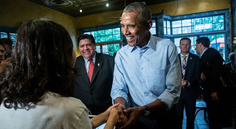 Former President Barack Obama talks to owner Young Jeon and orders food as he makes a campaign stop at Caffe Paradiso after speaking at University of Illinois in Urbana, Ill., on Sept. 7, 2018. Former President Barack Obama talks to owner Young Jeon and orders food as he makes a campaign stop at Caffe Paradiso after speaking at University of Illinois in Urbana, Ill., on Sept. 7, 2018.