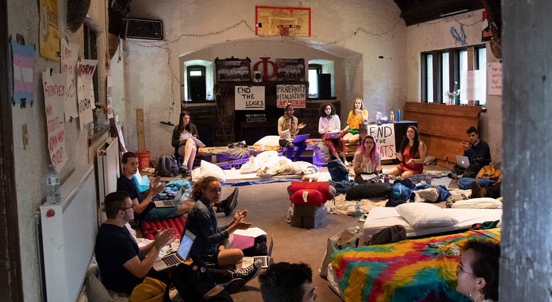 Students sing songs and protest during a sit-in inside the main hall of a fraternity house at Swarthmore College, April 30, 2019. Swarthmore College sit-in