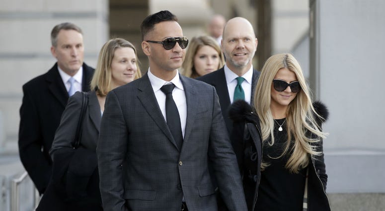 Michael "The Situation" Sorrentino walks with his fiancee Lauren Pesce while leaving the federal courthouse after a hearing in Newark, N.J., on Jan. 19, 2018. Michael "The Situation" Sorrentino walks with his fiancee Lauren Pesce while leaving the federal courthouse after a hearing in Newark, N.J., on Jan. 19, 2018.
