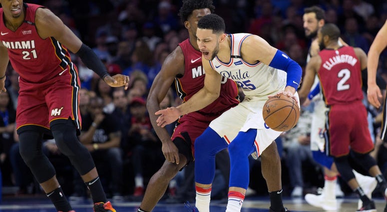 Ben Simmons (25) dribbles against the defense of Miami Heat forward Justise Winslow (20) during game two of the first round of the 2018 NBA Playoffs. Ben Simmons (25) dribbles against the defense of Miami Heat forward Justise Winslow (20) during game two of the first round of the 2018 NBA Playoffs.