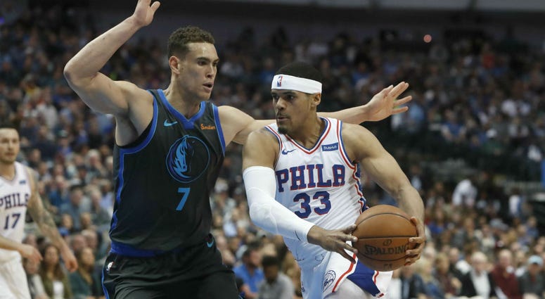 Philadelphia 76ers forward Tobias Harris (33) drives against Dallas Mavericks forward Dwight Powell (7) during the first half of an NBA basketball game in Dallas, Monday, April 1, 2019. Philadelphia 76ers forward Tobias Harris (33) drives against Dallas Mavericks forward Dwight Powell (7) during the first half of an NBA basketball game in Dallas, Monday, April 1, 2019.