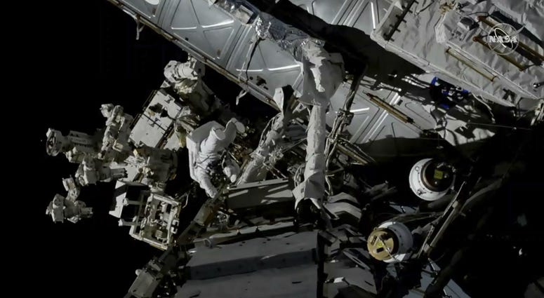 Canadian astronaut David Saint-Jacques, center left, works outside the International Space Station, Monday, April 8, 2019. Canadian astronaut David Saint-Jacques, center left, works outside the International Space Station, Monday, April 8, 2019.