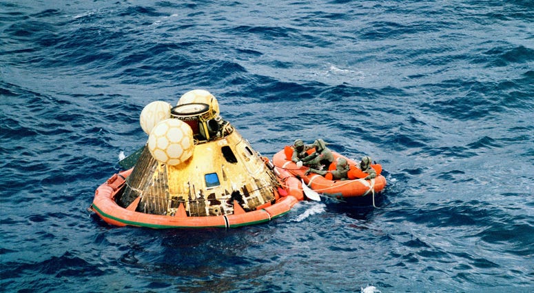 Columbia's hatch is closed with the three crew in the life raft along with Lt. Clancy Hatleberg.. Columbia's hatch is closed with the three crew in the life raft along with Lt. Clancy Hatleberg..