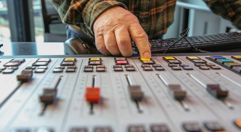 Anchor Brandon Brooks operates the new control board in the air studios. Anchor Brandon Brooks operates the new control board in the air studios.
