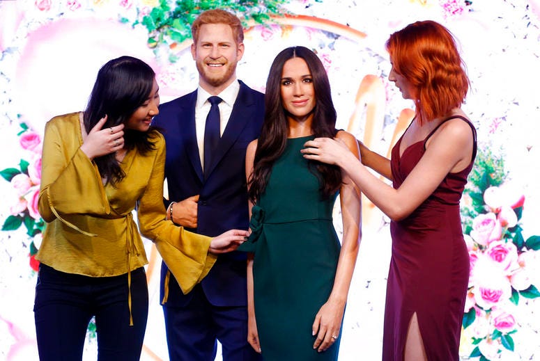 Visitors look at Britain's Prince Harry and his fiancee Meghan Markle who are on display as wax figures at Madame Tussauds in London. Visitors look at Britain's Prince Harry and his fiancee Meghan Markle who are on display as wax figures at Madame Tussauds in London.