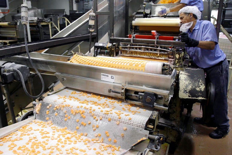 Sweethearts candy drop onto a conveyor belt as they are manufactured at the New England Confectionery Company. Sweethearts candy drop onto a conveyor belt as they are manufactured at the New England Confectionery Company.