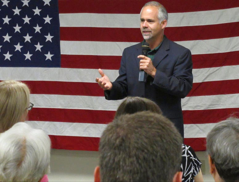 Then-Rep. Tim Huelskamp, R-Kan., speaks during a campaign town hall meeting at the headquarters of Patriot Outfitters, which sells firearms, accessories and hunting and military gear in St. Marys, Kan. Then-Rep. Tim Huelskamp, R-Kan., speaks during a campaign town hall meeting at the headquarters of Patriot Outfitters, which sells firearms, accessories and hunting and military gear in St. Marys, Kan.