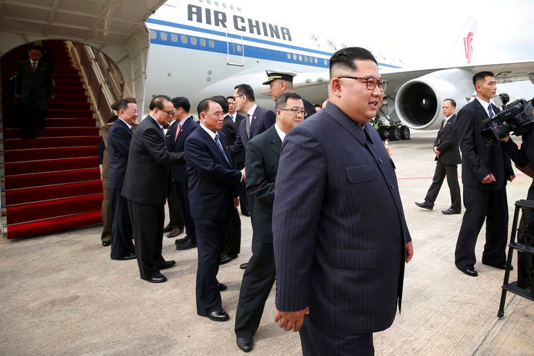 North Korean leader Kim Jong Un, right, arrives at the Changi International Airport. North Korean leader Kim Jong Un, right, arrives at the Changi International Airport.