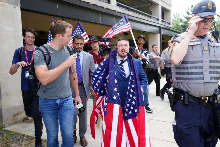 White nationalist Jason Kessler arrives at the Vienna metro station in Vienna, Va., Sunday, Aug. 12, 2018. White nationalist Jason Kessler arrives at the Vienna metro station in Vienna, Va., Sunday, Aug. 12, 2018.