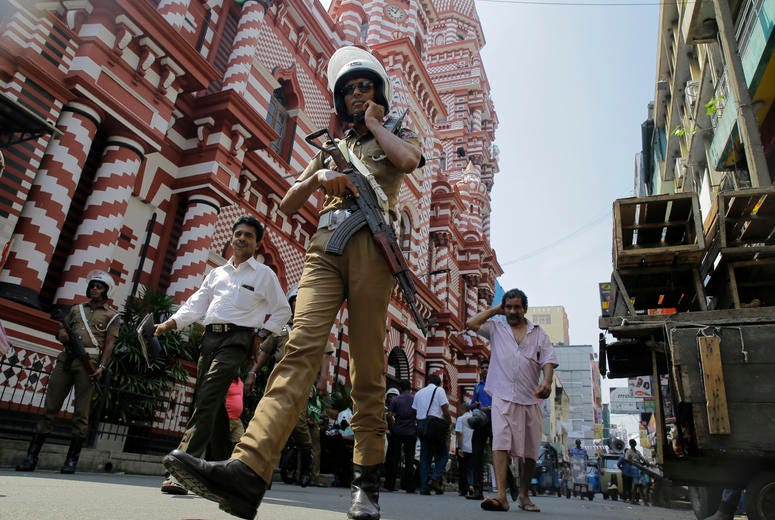 A Sri Lankan police officer patrols out side a mosque in Colombo, Sri Lanka, Wednesday, April 24, 2019. A Sri Lankan police officer.