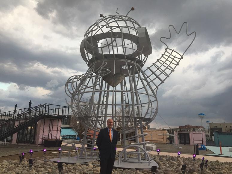 Randy Hope stands in front of Bebot, an art installation originally from Burning Man that now welcomes guests at Pizza Pod Park. Piazza Pod Park