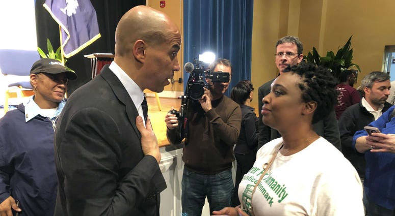 In this Feb. 10, 2019, file photo Sen. Cory Booker, D-N.J., talks with Deanna Miller Berry in Denmark, S.C. Several Democratic presidential candidates are trying to make a play for rural voters. In this Feb. 10, 2019, file photo Sen. Cory Booker, D-N.J., talks with Deanna Miller Berry in Denmark, S.C. Several Democratic presidential candidates are trying to make a play for rural voters.