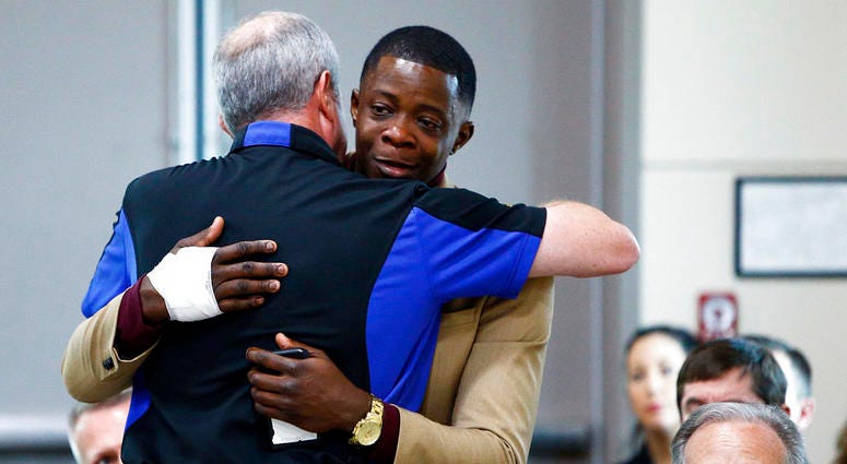 James Shaw, right, gets a hug from Waffle House CEO Walt Ehmer during a press conference on the Waffle House shooting Sunday, April 22, 2018 in Nashville, Tenn. Shaw wrestled the gun from the suspect. James Shaw / Waffle House Shooting Hero