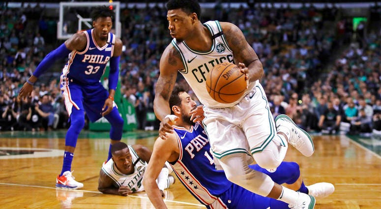 Boston Celtics guard Marcus Smart, right, drives past Philadelphia 76ers guard Marco Belinelli during the first quarter of Game 5. Boston Celtics guard Marcus Smart, right, drives past Philadelphia 76ers guard Marco Belinelli during the first quarter of Game 5.