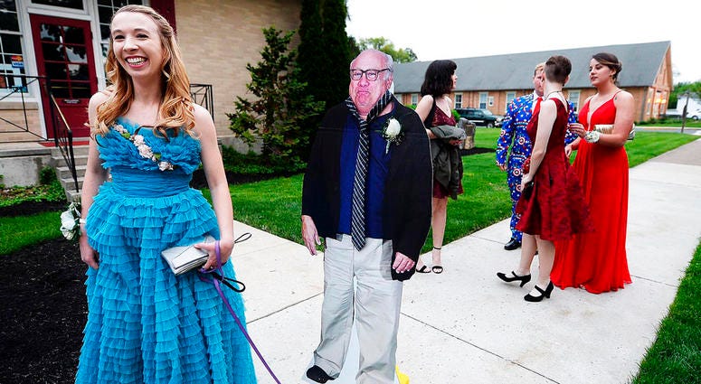 Allison Closs arrives for the Carlisle High School senior prom at Letort View Community Center at Carlisle Barracks in Carlise, Pa., with a cutout of actor Danny DeVito. Allison Closs arrives for the Carlisle High School senior prom at Letort View Community Center at Carlisle Barracks in Carlise, Pa., with a cutout of actor Danny DeVito.