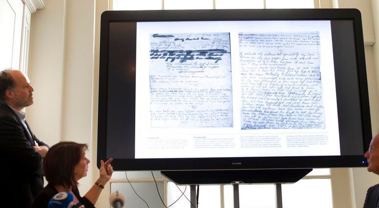 A video shows the text underneath two taped off pages from Anne Frank's diary during a press conference at The Anne Frank Foundation's office in Amsterdam. A video shows the text underneath two taped off pages from Anne Frank's diary during a press conference at The Anne Frank Foundation's office in Amsterdam.
