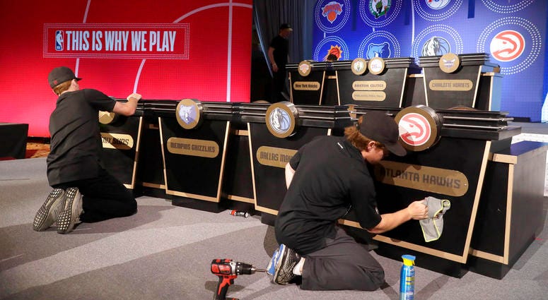 Stage hands prepare the set for the NBA basketball draft lottery. Stage hands prepare the set for the NBA basketball draft lottery.