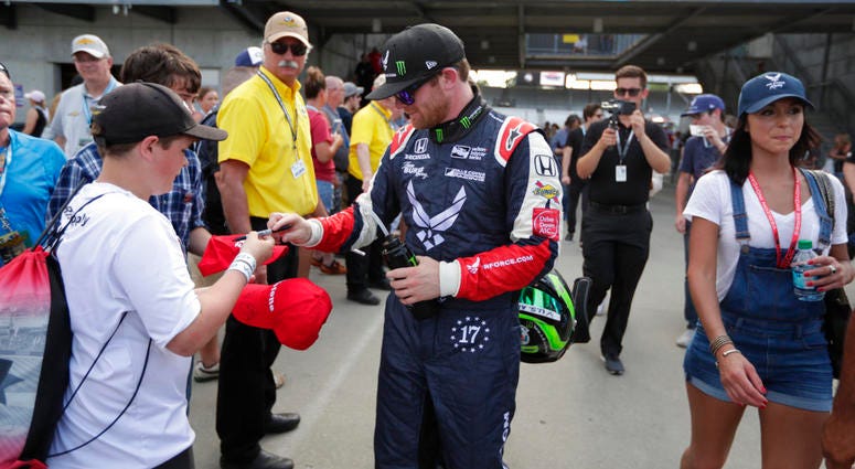 Conor Daly signs an autograph for a fan after he qualified for the IndyCar Indianapolis 500 auto race at Indianapolis Motor Speedway in Indianapolis. Conor Daly signs an autograph for a fan after he qualified for the IndyCar Indianapolis 500 auto race at Indianapolis Motor Speedway in Indianapolis.