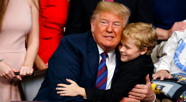 President Donald Trump hugs Duchenne Muscular Dystrophy patient Jordan McLinn after signing the "Right to Try" act in the South Court Auditorium on the White House campus. President Donald Trump hugs Duchenne Muscular Dystrophy patient Jordan McLinn after signing the "Right to Try" act in the South Court Auditorium on the White House campus.