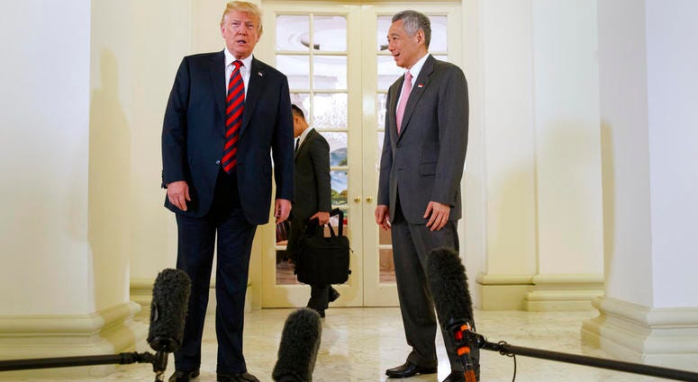 President Donald Trump meets with Singapore Prime Minister Lee Hsien Loong ahead of a summit with North Korean leader Kim Jong Un. President Donald Trump meets with Singapore Prime Minister Lee Hsien Loong ahead of a summit with North Korean leader Kim Jong Un.