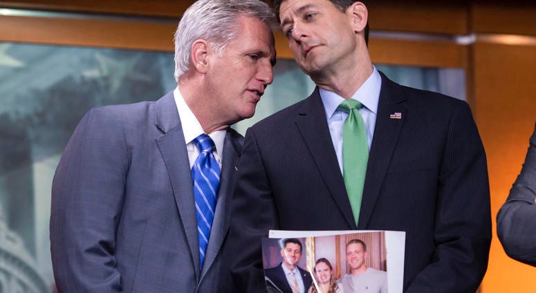 House Majority Leader Kevin McCarthy (left) and Speaker of the House Paul Ryan confer during a news conference. Ryan is holding a photo of a Wisconsin family which he referred to later while discussing the war on opioid addiction. House Majority Leader Kevin McCarthy (left) and Speaker of the House Paul Ryan confer during a news conference. Ryan is holding a photo of a Wisconsin family which he referred to later while discussing the war on opioid addiction.