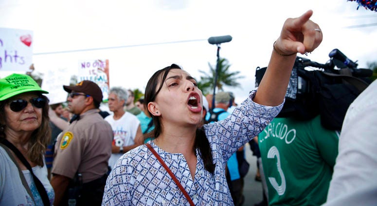 1 A protester yells toward a Trump supporter after arriving to the Homestead Temporary Shelter for Unaccompanied Children, on Saturday, June 23, 2018, in Homestead, Fla. 1 A protester yells toward a Trump supporter after arriving to the Homestead Temporary Shelter for Unaccompanied Children, on Saturday, June 23, 2018, in Homestead, Fla.
