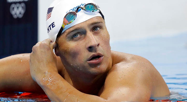 In this Aug. 9, 2016 file photo, United States' swimmer Ryan Lochte checks his time in a men's 4x200-meter freestyle heat at the 2016 Summer Olympics in Rio de Janeiro, Brazil. In this Aug. 9, 2016 file photo, United States' swimmer Ryan Lochte checks his time in a men's 4x200-meter freestyle heat at the 2016 Summer Olympics in Rio de Janeiro, Brazil.