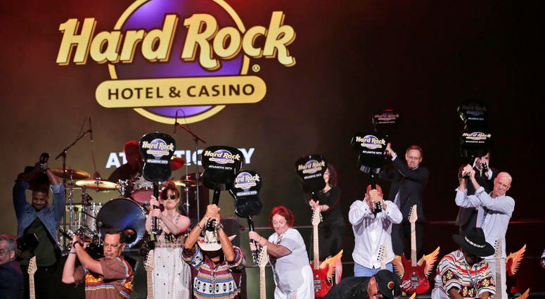 Celebrities and VIPs smash guitars as part of the grand opening celebration at the Hard Rock Hotel and Casino in Atlantic City, N.J. Celebrities and VIPs smash guitars as part of the grand opening celebration at the Hard Rock Hotel and Casino in Atlantic City, N.J.
