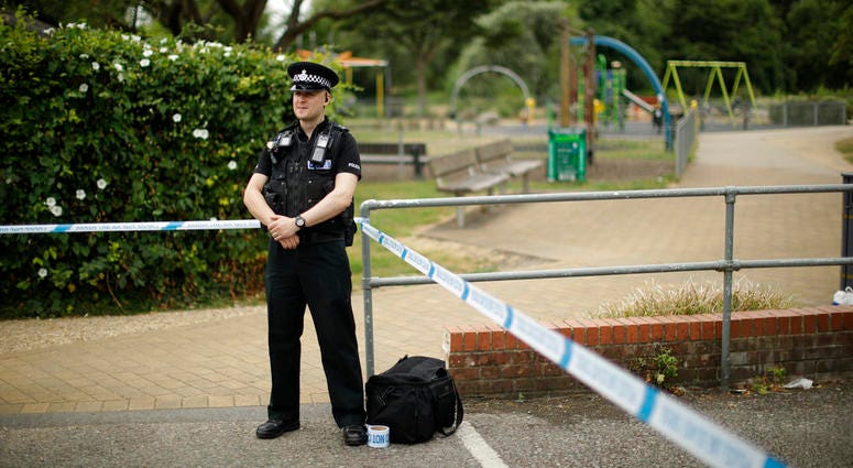 A British police officer guards a cordon outside the Queen Elizabeth Gardens park in Salisbury, England. A British police officer guards a cordon outside the Queen Elizabeth Gardens park in Salisbury, England.