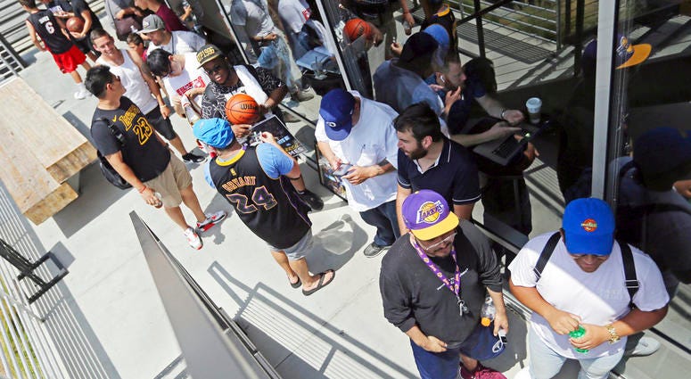 Los Angeles Lakers fans wait in line around noon for promised free pizza that will be handed out between 2 and 5 p.m. at Blaze Pizza, a restaurant chain NBA basketball player LeBron James was an original investor in. Los Angeles Lakers fans wait in line around noon for promised free pizza that will be handed out between 2 and 5 p.m. at Blaze Pizza, a restaurant chain NBA basketball player LeBron James was an original investor in.