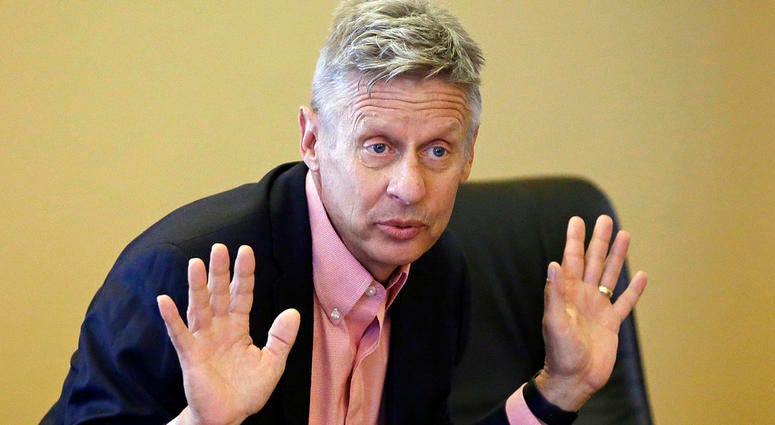 In this May 18, 2016 file photo, Libertarian presidential candidate and former New Mexico Gov. Gary Johnson speaks with legislators at the Utah State Capitol in Salt Lake City. Gary Johnson
