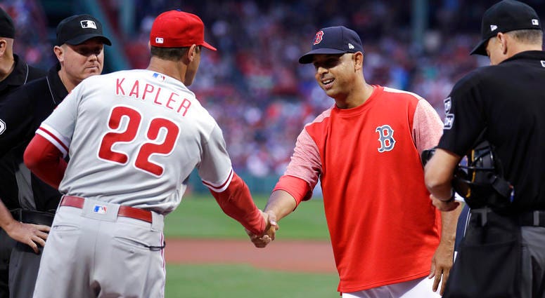 Boston Red Sox manager Alex Cora, right, shakes hands with Philadelphia Phillies manager Gabe Kapler (22) prior to the first inning of a baseball game at Fenway Park in Boston, Monday, July 30, 2018. Boston Red Sox manager Alex Cora, right, shakes hands with Philadelphia Phillies manager Gabe Kapler (22) prior to the first inning of a baseball game at Fenway Park in Boston, Monday, July 30, 2018.