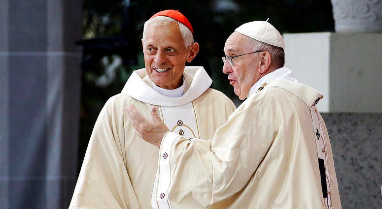 In this Sept. 23, 2015, file photo, Cardinal Donald Wuerl, archbishop of Washington, left, looks toward the crowd with Pope Francis following a Mass outside the Basilica of the National Shrine of the Immaculate Conception in Washington. In this Sept. 23, 2015, file photo, Cardinal Donald Wuerl, archbishop of Washington, left, looks toward the crowd with Pope Francis following a Mass outside the Basilica of the National Shrine of the Immaculate Conception in Washington.