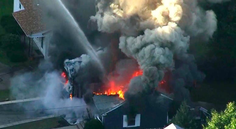 In this Sept. 13, 2018, file image take from video provided by WCVB in Boston, flames consume the roof of a home in Lawrence, Mass, a suburb of Boston. In this Sept. 13, 2018, file image take from video provided by WCVB in Boston, flames consume the roof of a home in Lawrence, Mass, a suburb of Boston.