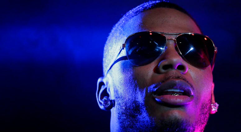 In this April 18, 2015, file photo, rapper Nelly performs on stage during a Corner Block Party concert at Auburn University in Auburn, Ala. Nelly