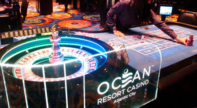 A dealer pushes a stack of chips toward a gambler at the Ocean Resort Casino in Atlantic City N.J. Ocean Casino