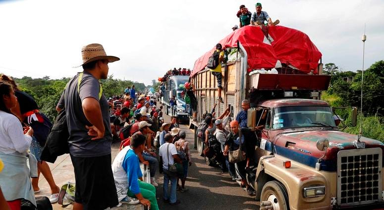 Central American migrants, part of the caravan hoping to reach the U.S. border, get a ride on trucks, in Donaji, Oaxaca state, Mexico, Friday, Nov. 2, 2018. Migrant Caravan