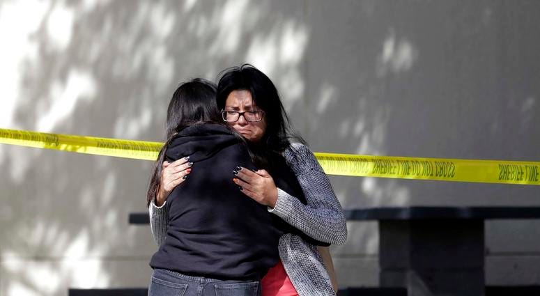 Mourners embrace outside of the Thousand Oaks Teen Center on Thursday, Nov. 8, 2018, where relatives and friends gathered in the aftermath of the Wednesday night mass shooting, in Thousand Oaks, Calif. California Bar Shooting