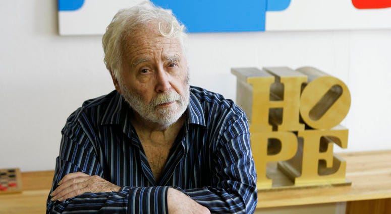 In this Aug. 29, 2009, file photo, artist Robert Indiana poses at his studio in Vinalhaven, Maine. Robert Indiana
