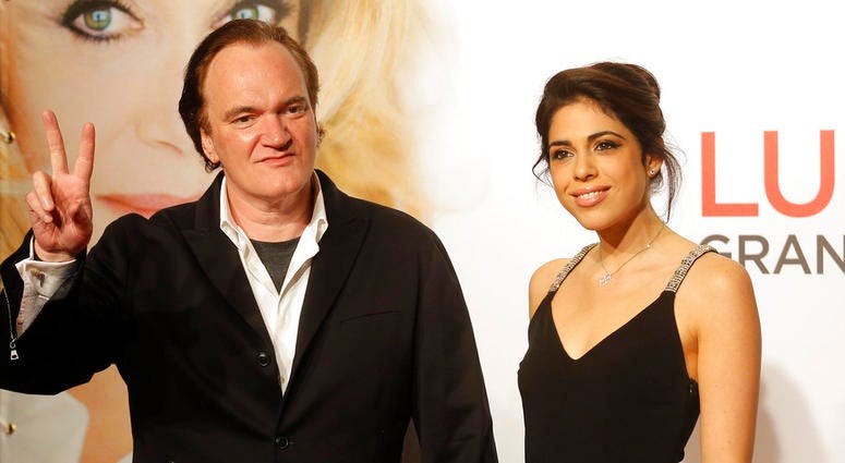 FILE - In this Oct. 8, 2016 file photo, director Quentin Tarantino, left, and singer Daniella Pick arrive at the opening ceremony of the 8th Lumiere Festival in Lyon, central France. FILE - In this Oct. 8, 2016 file photo, director Quentin Tarantino, left, and singer Daniella Pick arrive at the opening ceremony of the 8th Lumiere Festival in Lyon, central France.