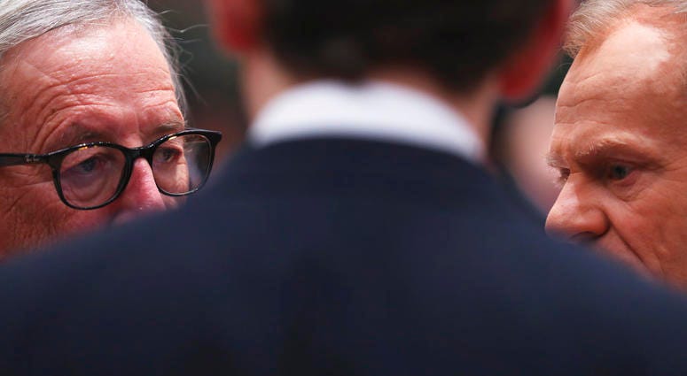 European Commission President Jean-Claude Juncker, left, and European Council President Donald Tusk, right, speak with Austrian Chancellor Sebastian Kurz during a round table meeting at an EU summit in Brussels, Friday, Dec. 14, 2018. European Commission President Jean-Claude Juncker, left, and European Council President Donald Tusk, right, speak with Austrian Chancellor Sebastian Kurz during a round table meeting at an EU summit in Brussels, Friday, Dec. 14, 2018.