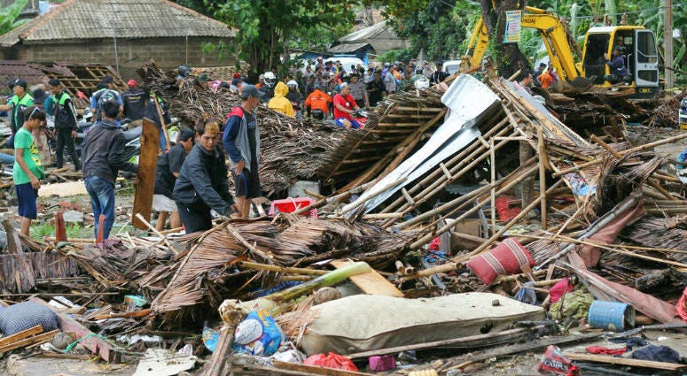 Residents inspect a house damaged by a tsunami, in Carita, Indonesia, Sunday, Dec. 23, 2018. Residents inspect a house damaged by a tsunami, in Carita, Indonesia, Sunday, Dec. 23, 2018.