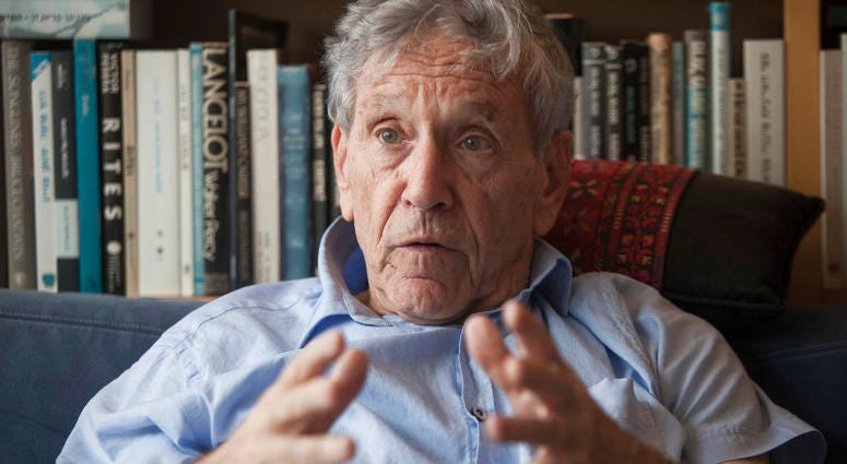 In this Nov. 4, 2015 file photo, Israeli writer Amos Oz poses for a photo at his house in Tel Aviv, Israel. Amos Oz