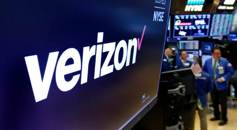 FILE- This April 23, 2018, file photo shows the logo for Verizon above a trading post on the floor of the New York Stock Exchange. FILE- This April 23, 2018, file photo shows the logo for Verizon above a trading post on the floor of the New York Stock Exchange.