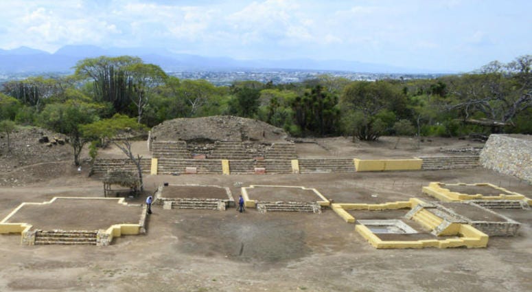 In this 2018 photo provided by Mexico's National Institute of Anthropology and History, INAH, investigators work at the Ndachjian–Tehuacan archaeological site in Tehuacan, Puebla state, Mexico, where archaeologist have identified the first known temple to In this 2018 photo provided by Mexico's National Institute of Anthropology and History, INAH, investigators work at the Ndachjian–Tehuacan archaeological site in Tehuacan, Puebla state, Mexico, where archaeologist have identified the first known temple to