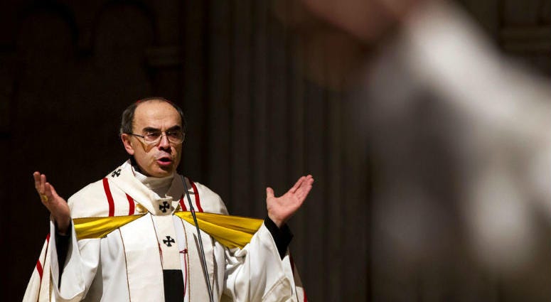 FILE - In this April 3, 2016 file photo, French Cardinal Philippe Barbarin, Archbishop of Lyon, leads a mass for migrants in the Saint-Jean Cathedral, in Lyon, central France. FILE - In this April 3, 2016 file photo, French Cardinal Philippe Barbarin, Archbishop of Lyon, leads a mass for migrants in the Saint-Jean Cathedral, in Lyon, central France.